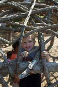 a child practicing self-care skills with Montessori dressing frames